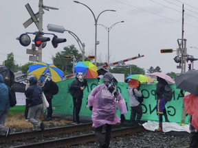 Protesters block a railway line